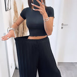 Maya | Pantaloni negri plisați — confort ușor și croială lină