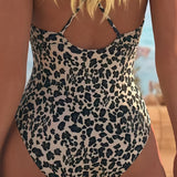 Costum de baie cu model leopard și guler în V